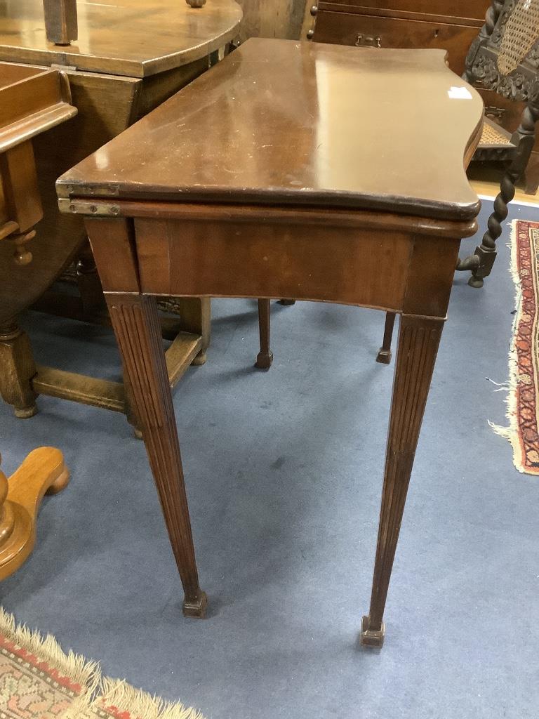A George III style mahogany serpentine folding card table, width 87cm, depth 44cm, height 74cm